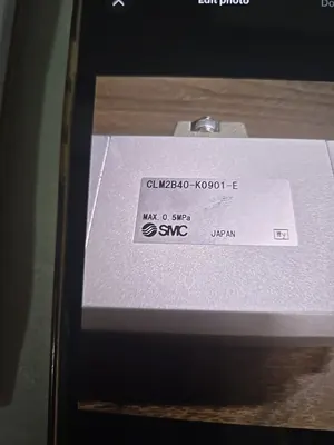 SMC pneumatic cylinder valve on the bench beside its box